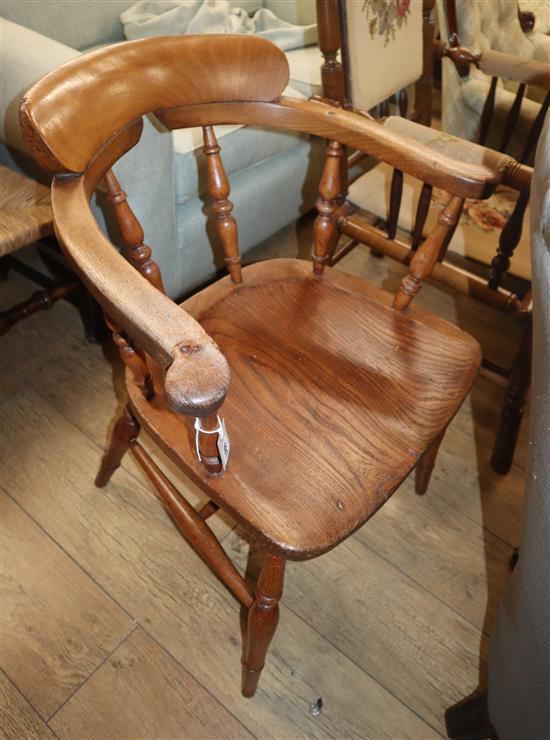 A Victorian elm and beech smokers bow chair